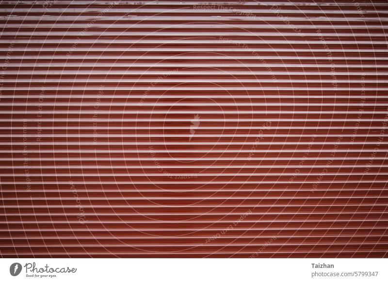 Metalic commercial roll up door texture . Horizontal shot , copy space abstract background blank blinds closed color cover design detail dirty entrance folding