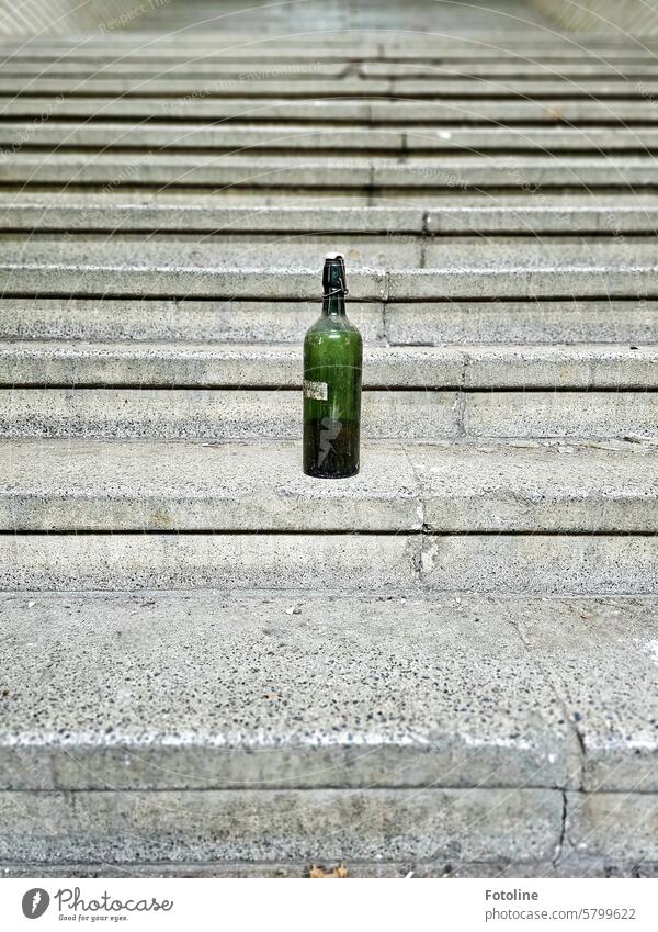 Someone must have left the glass bottle on the steps of the long staircase. Stairs Architecture stagger Stone Stone steps Upward Structures and shapes