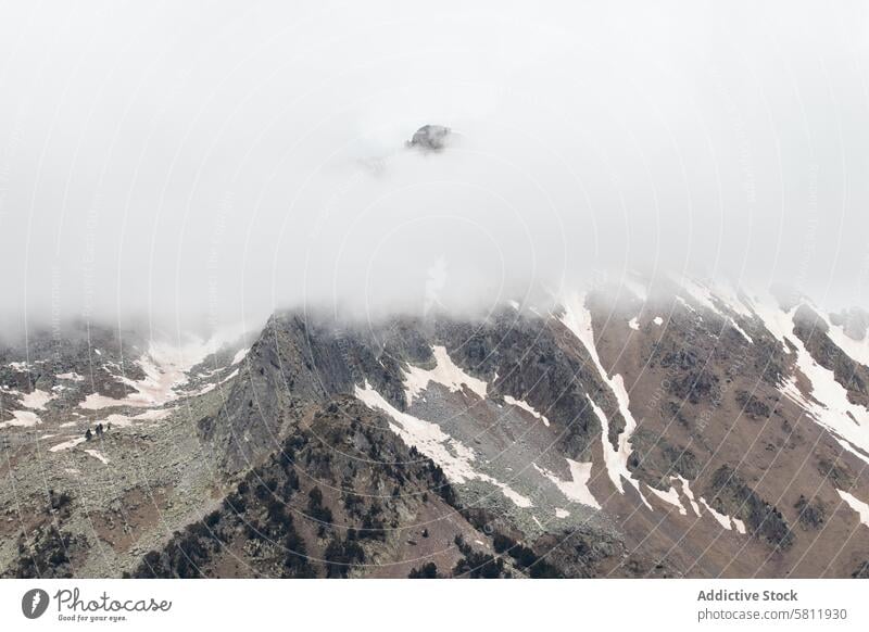 Rocky mountains covered with snow on sunny day range cloud landscape scenery highland rock ridge breathtaking pyrenees scenic formation terrain slope season