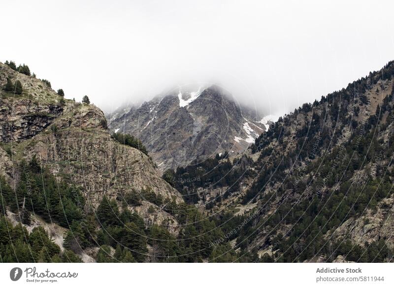 Rocky mountains covered with snow on sunny day range cloud landscape scenery highland rock ridge breathtaking pyrenees scenic formation terrain slope season