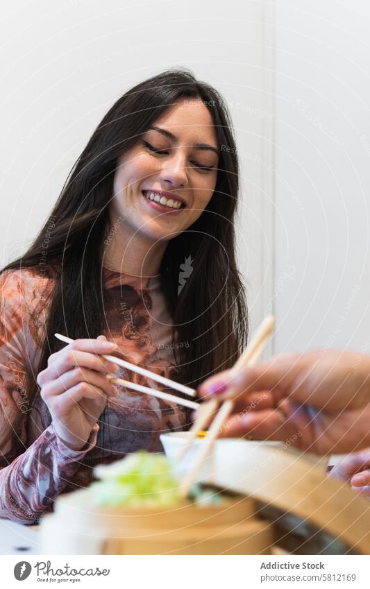 Delighted friendly multiethnic women eating in restaurant chill poke dish tasty friendship together female enjoy weekend happy relax yummy smile table food