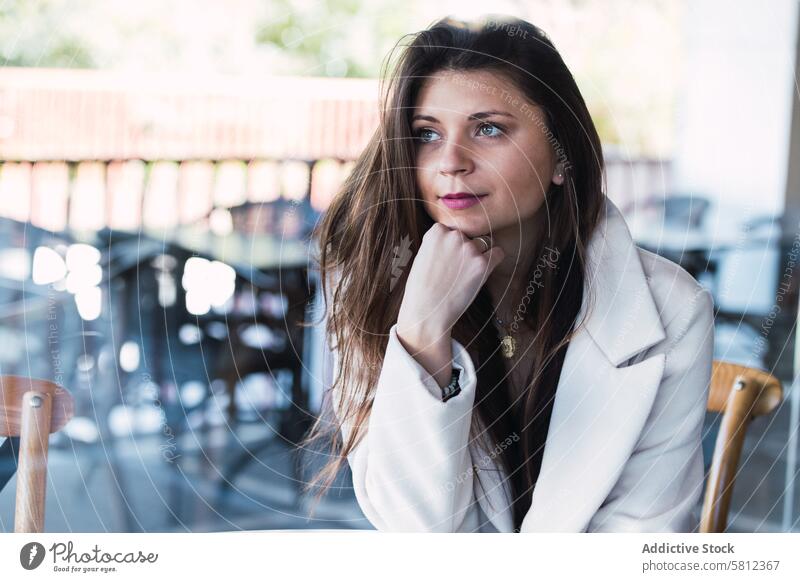 Pensive stylish woman resting in cafe pensive dreamy style thoughtful relax fashion calm contemplate think trendy female adult lifestyle ponder tranquil wistful