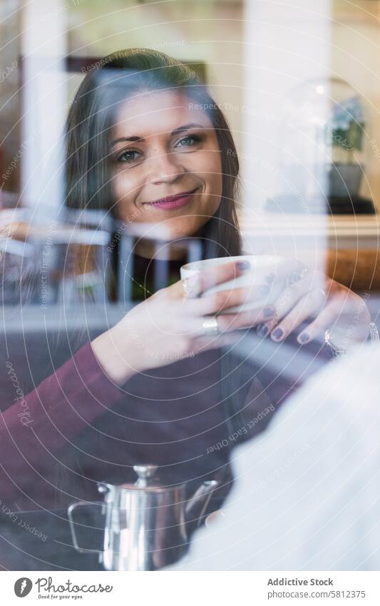 Multiracial couple chatting during breakfast in cafe together drink happy morning cup relationship love communicate cozy beverage cheerful lifestyle rest mug