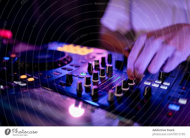 Close-up of DJ working using mixing table in a club close-up hand dj turntable board music caucasian young unrecognizable touch industry electronic stage disco