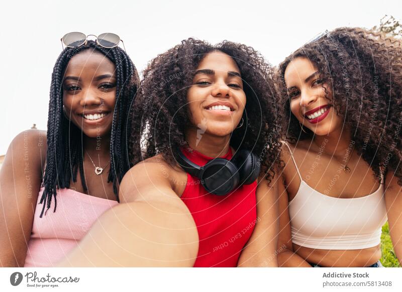 Young Friends Enjoying Summer Together and taking selfies African American Diversity Youth Communication Joy Laughter Happiness Leisure Relaxation Outdoors Fun