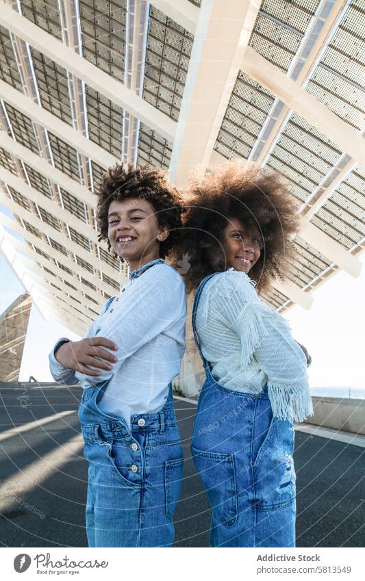 Cheerful African American teenagers in denim outfits kid afro cheerful smile sibling curly hair together urban black african american ethnic sister brother