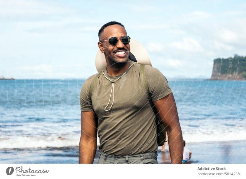 Black man wearing sunglasses in the beach black male young background guy stylish vacation happy travel portrait lifestyle cool smile handsome confident