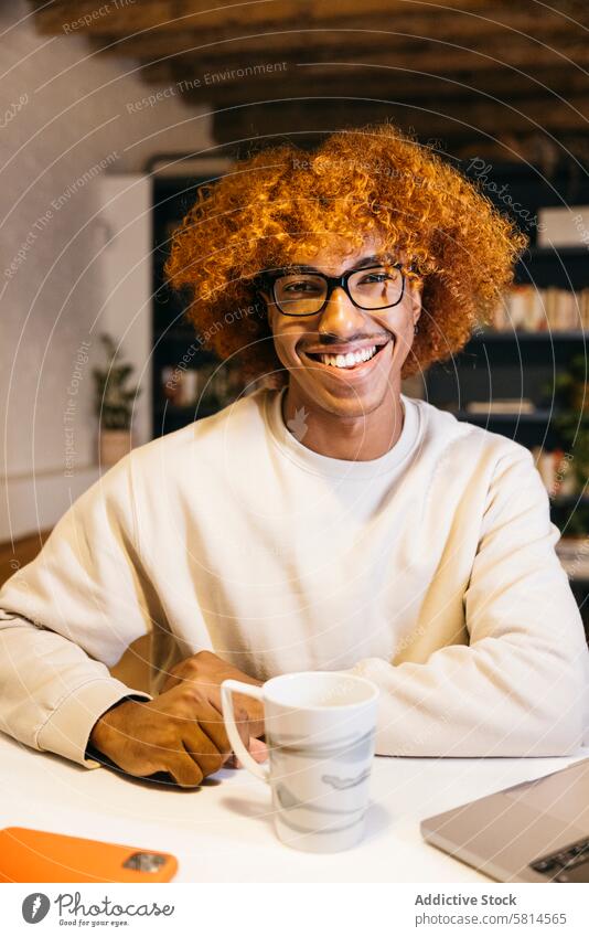 Portrait of a man in a living room. adult man african american ethnicity afro afro hairstyle attractive beautiful man beautiful people black black male