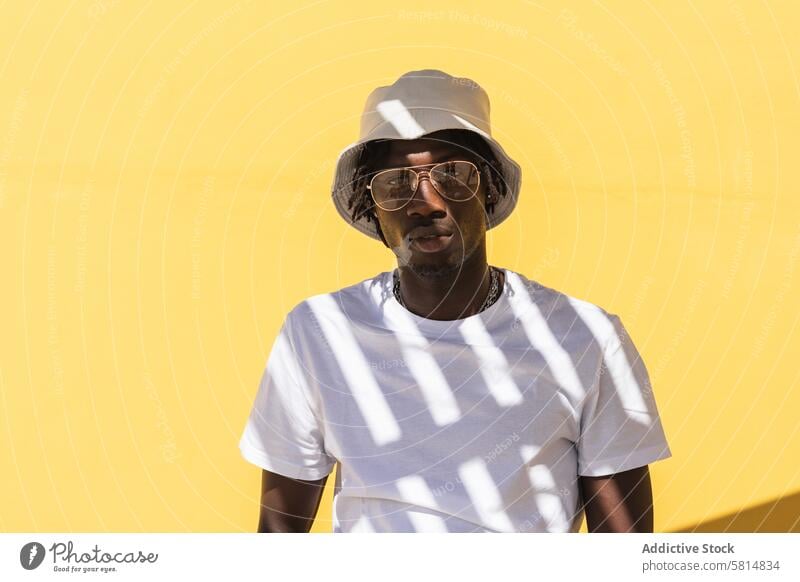 Young black man in panama hat hipster shadow stripe style sunglasses trendy colorful african american ethnic male eyewear eyeglasses headwear guy casual white