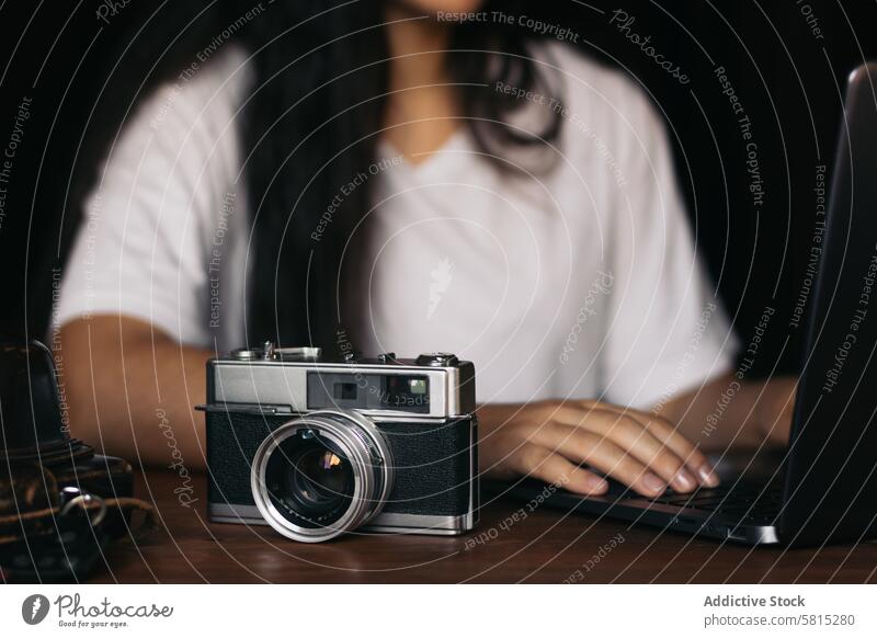 Analog camera and laptop: old and new technology. woman photo lifestyle photography vintage retro analog shoot concept pictures hobby photographing classic