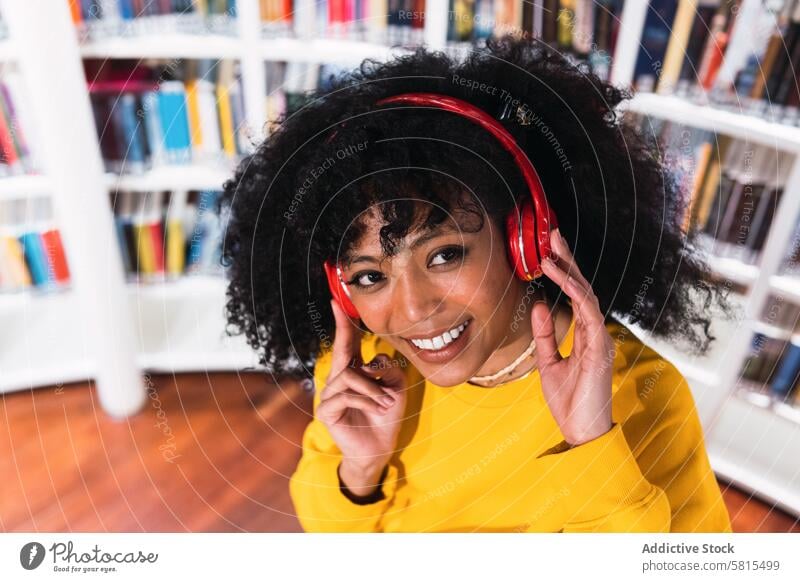 Portrait of cheerful African American woman in headphones melomaniac smile music portrait listen enjoy high angle ethnic happy student african american female