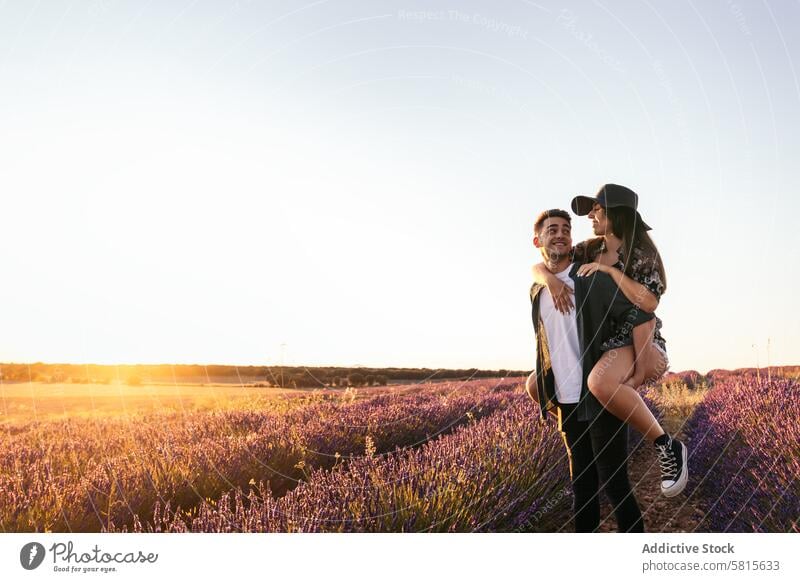 Lovely young couple in a floral field lavender sunset love woman summer purple happy together beautiful nature romantic relationship lifestyle romance flower