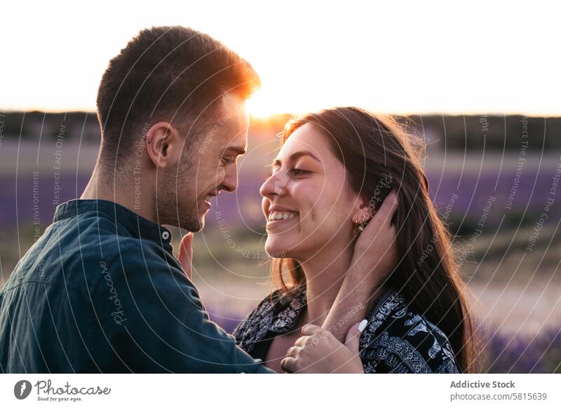 Couple in love in a lavender field at sunset couple woman summer purple happy together beautiful young nature romantic relationship lifestyle romance flower