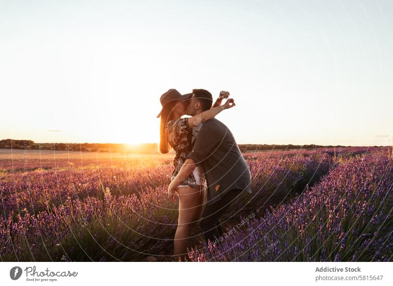 Beautiful romantic photo of a couple in a field of flowers at sunset lavender love woman summer purple happy together beautiful young nature relationship