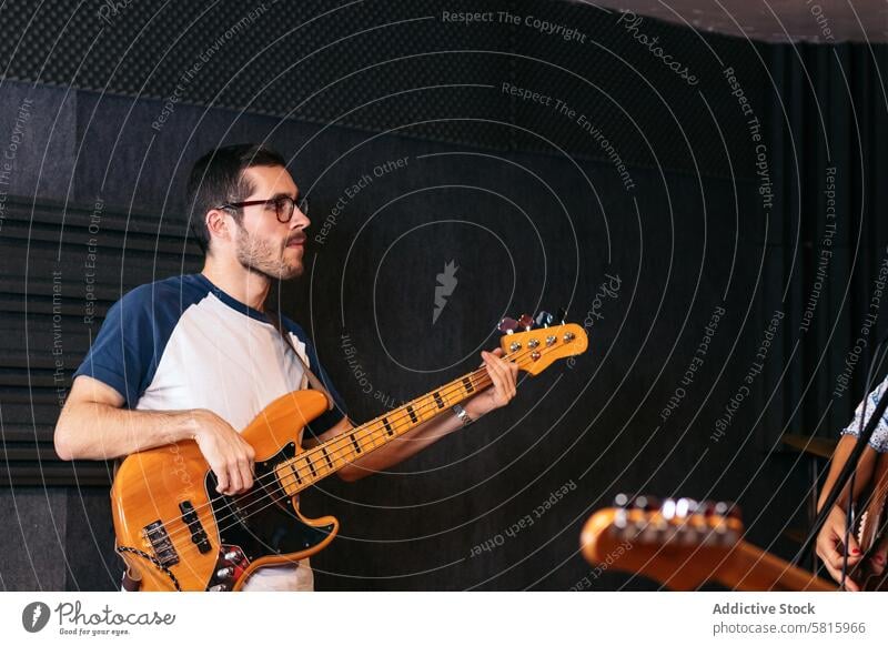 Close-up of a musician playing bass Musician Bass guitar Rehearsal Passion Creativity Art Performance Instrument Melody Rhythm Sound Practice Jamming Groove