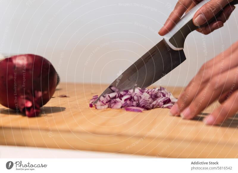 Crop woman cutting onion in kitchen cook prepare red onion chop culinary knife female ingredient process food home vegetable lady meal utensil healthy food