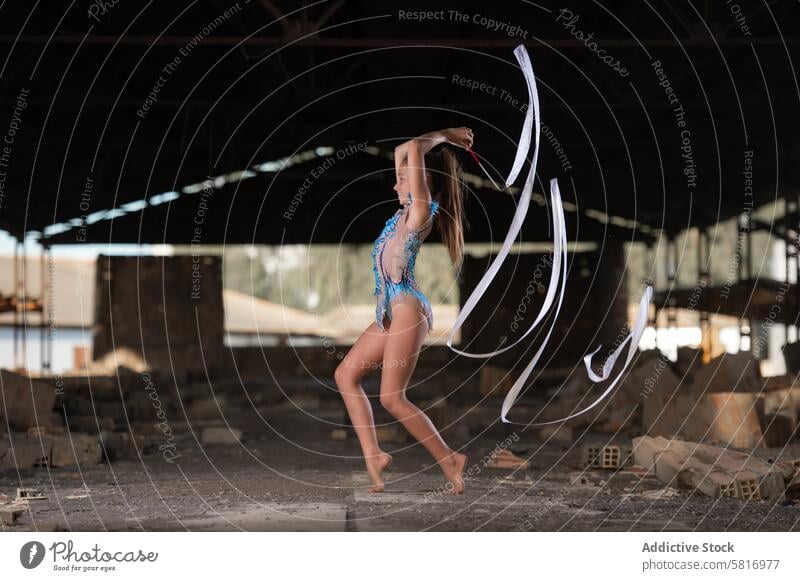 Young girl performing rhythmic gymnastics exercises outdoors dancing jump physical fitness dancer sport athlete nourishment sea beach cloud sunset person sweat