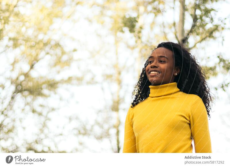 african american girl walking and smiling in a park woman happy young lifestyle female summer nature leisure people together black fun beautiful outdoor 20s