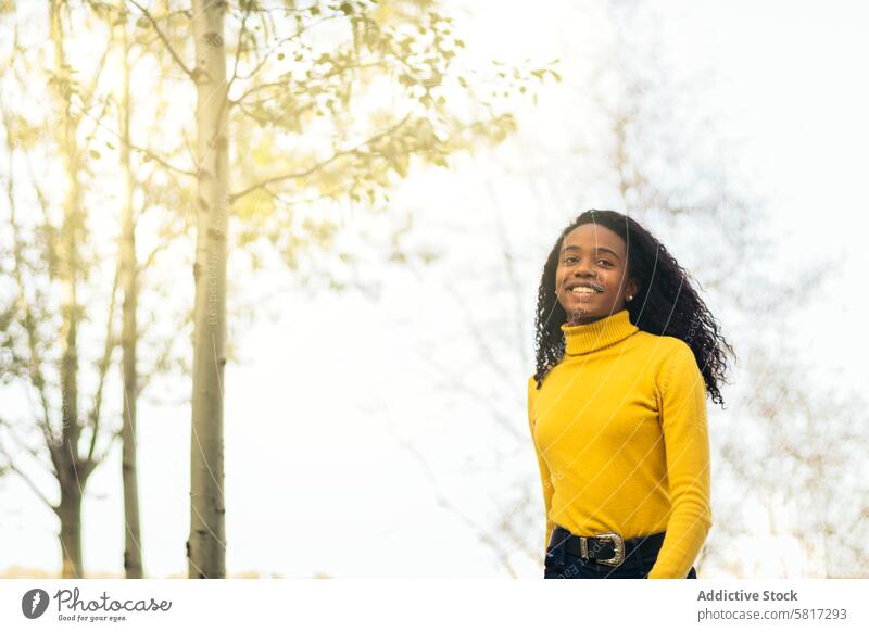 african american girl walking and smiling in a park woman happy young lifestyle female summer nature leisure people together black fun beautiful outdoor 20s