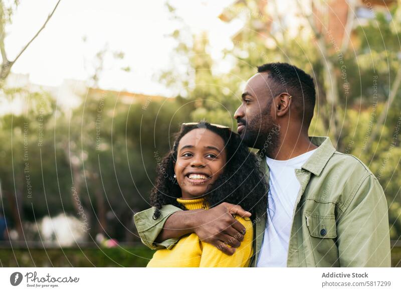 black man hugging afro american woman happy young african couple love together female beautiful adult people girl lifestyle boyfriend girlfriend family