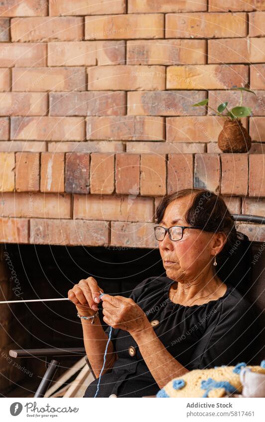 Thread of joy. Asian senior knits her life's story. active aging art and craft artistic artistic expression authenticity care cozy home craftsmanship creation