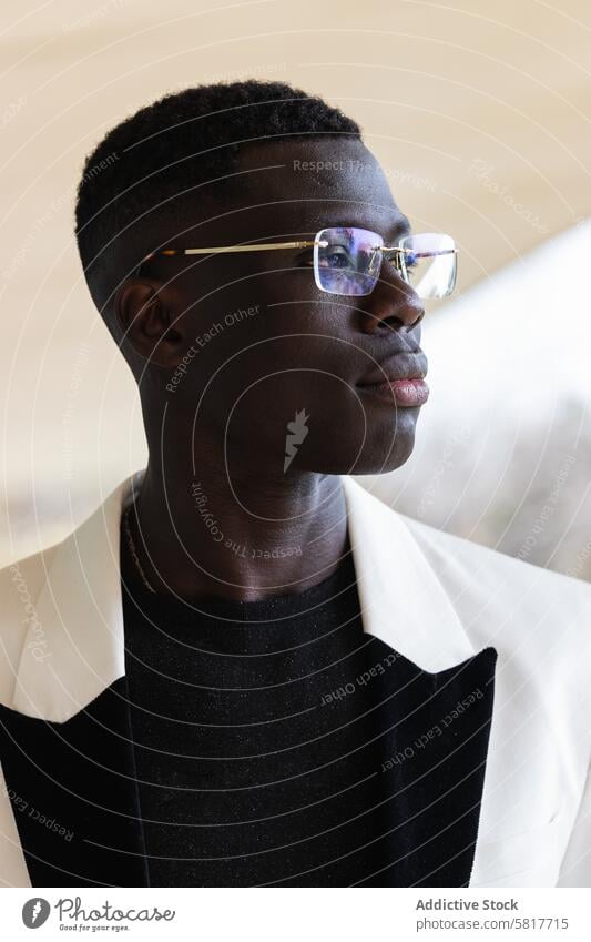 Stylish African American businessman in eyeglasses in town style confident individuality independent masculine macho portrait jacket smart casual city