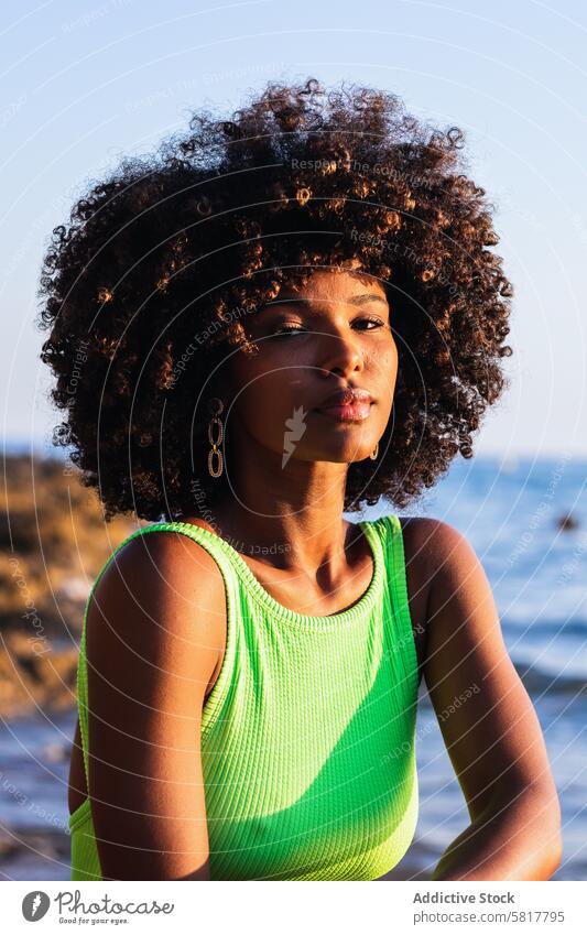 dreamy black woman standing in sea during summer vacation swimsuit water sunset female ethnic african american rest travel relax summertime afro positive