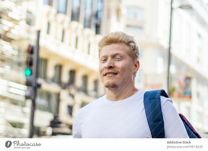 Close-up of albino latino man in the city street. white male guy blond isolated face person young hair adult handsome albinism blonde skin lifestyle expression