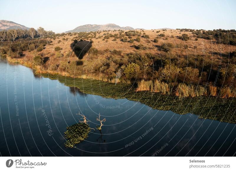 shadowy existence Sky Light Shadow hot-air balloon Nature Africa South Africa Lake River Landscape