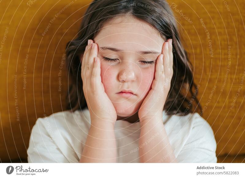 Young girl feeling dizzy and exhausted from hypoglycemia unwell headache tired exhaustion symptom health illness child close-up portrait troubled pain