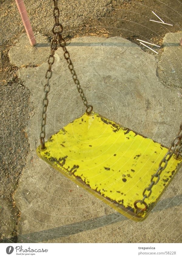 one Swing Playground Concrete yellow- pink Chain Loneliness