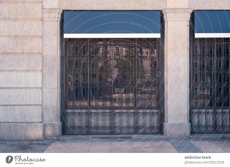 Empty billboard on classic building facade in Madrid mockup advertising display madrid stone metal grill empty marketing city urban public street architecture