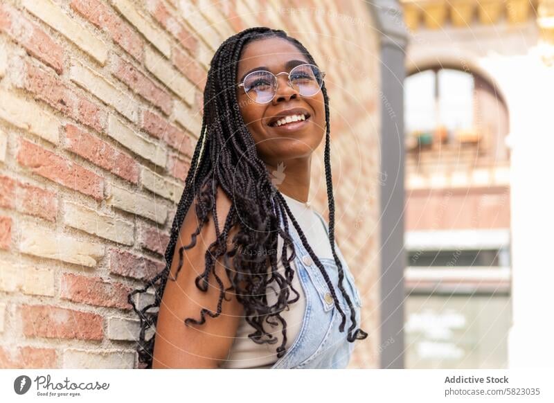 Joyful summer day with a friend in Barcelona woman smile barcelona happiness radiant african american sunny young warmth leisure vacation urban casual fashion