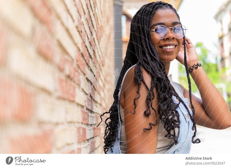 Stylish Young Woman Enjoying Summer in Barcelona woman summer barcelona smile sunglasses braids happy street cheerful carefree youth sunny city african american
