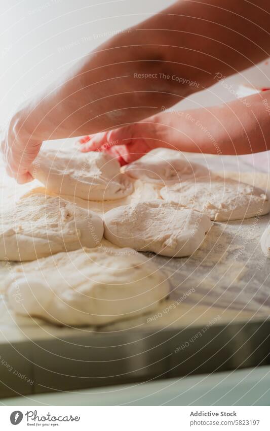 Close-up of pizza dough preparation in pizzeria flour hand food work baking cooking cuisine italian fresh artisan homemade anonymous faceless close-up kitchen