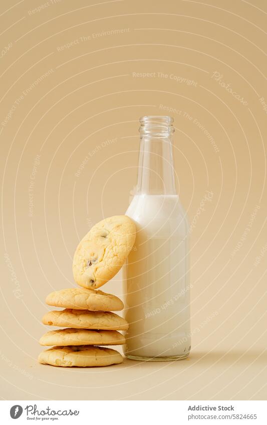 Raisin biscuits stacked beside a bottle of milk raisin cookie glass homemade snack beige background fresh dairy baked sweet dessert comforting food pastry