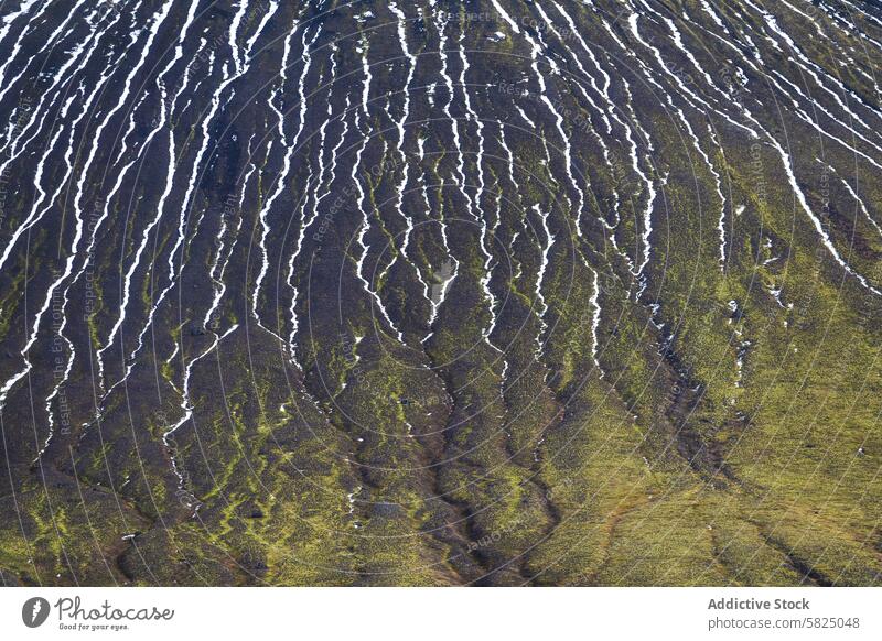 Textured Icelandic highland slopes with snow lines iceland texture aerial view view natural abstract hillside pattern moss green white melting contrast