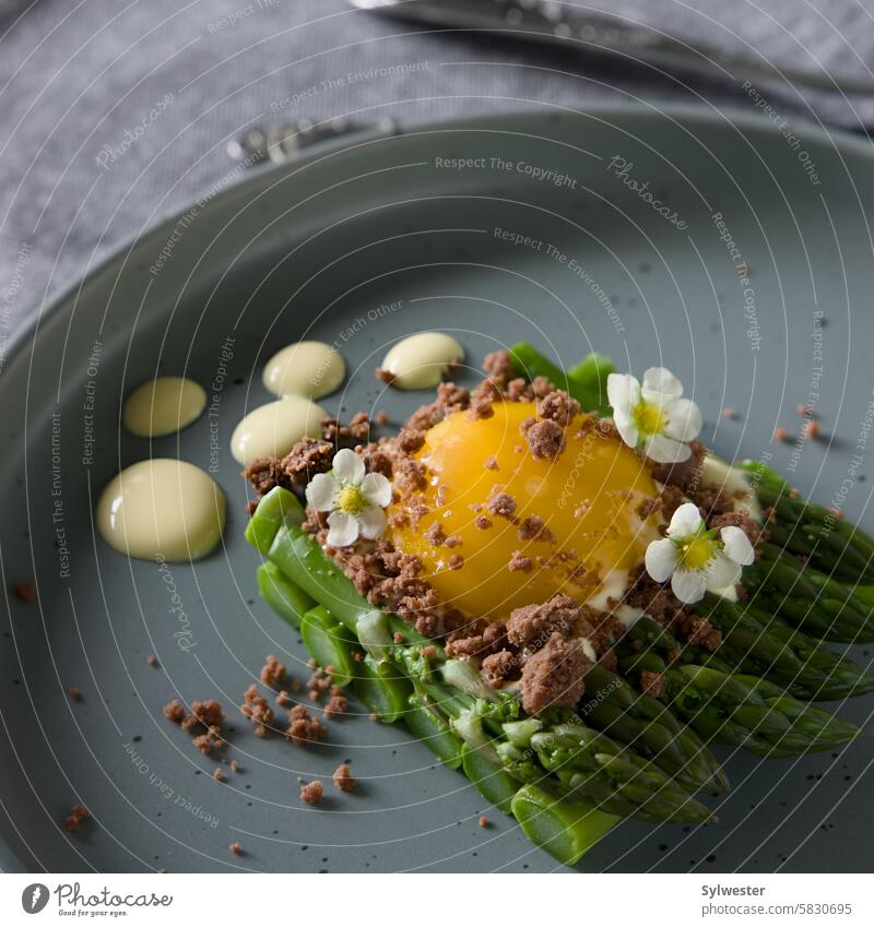 green asparagus with egg and crumble on a gray plate lunch Vegetable