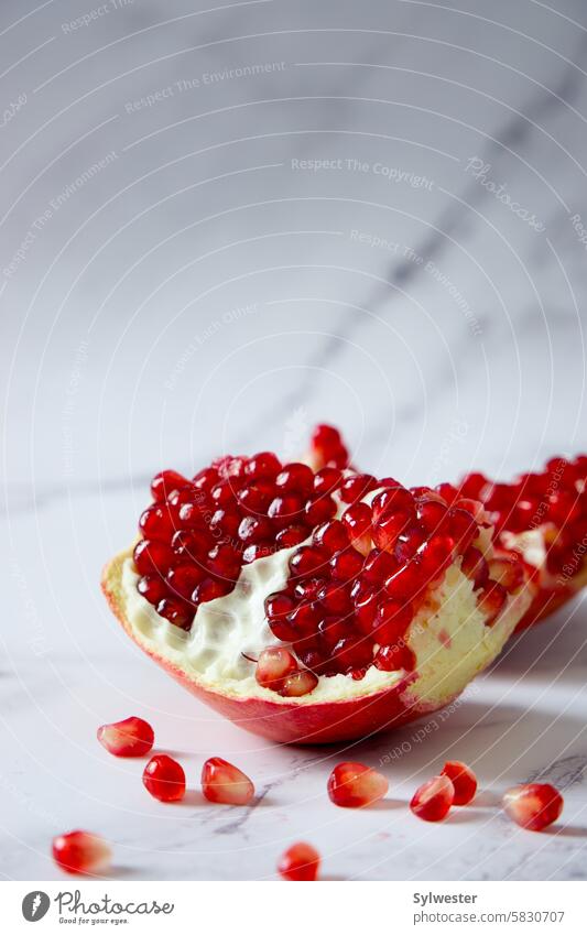 pomegranate fruit on white background Pomegranate fruit salad dessert ice cream with pomegranate red
