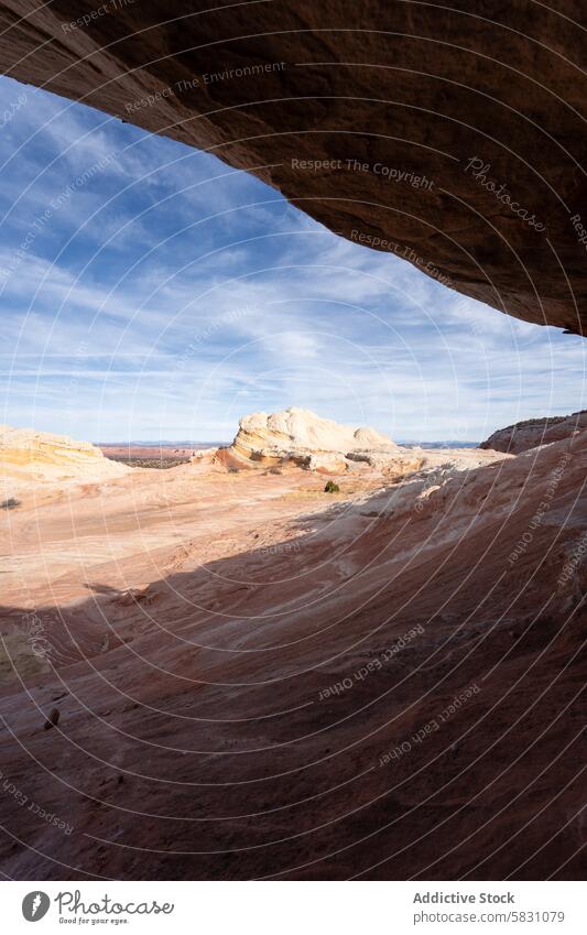 Majestic Arizona desert panorama from beneath rock overhang arizona landscape sediment sky blue clear vast nature geology outdoor scenic travel tourism