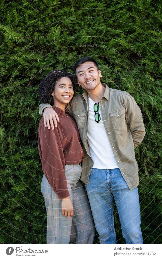 Generated image couple multiethnic chinese hispanic madrid spain greenery smile love man woman outdoor portrait happy diverse joy urban nature city casual