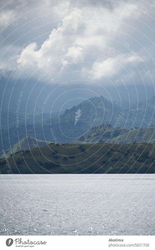 Hazy Coastal Mountain Clouds Ocean Water Morning layers Komodo National Park Indonesia Sky Exterior shot Landscape Fog Nature Vacation & Travel Peak