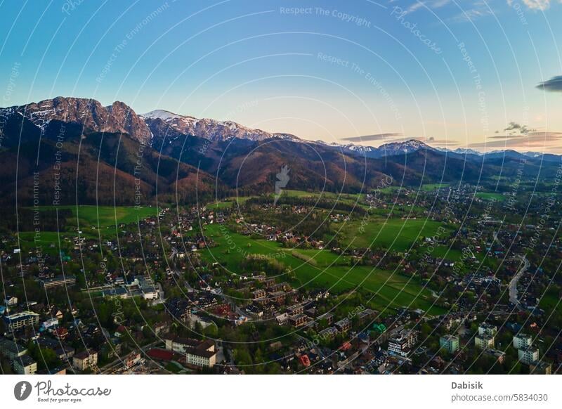 Aerial view of Tatra mountains and Zakopane town at sunset tatra mountains giewont zakopane valley landscape nature aerial view poland countryside field forest