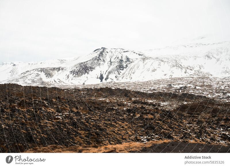 Snow-covered mountains and rocky terrain in Iceland iceland landscape snow volcanic rocks scenic snaefellsnes peninsula nature outdoor cold winter rugged