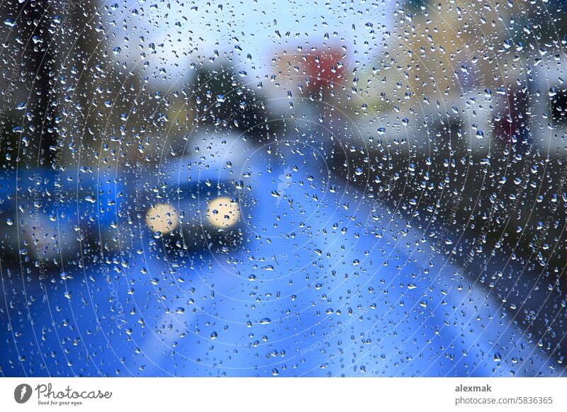 it's raining behind the window drop glass wet jet downpour it is raining it rains drip nature weather outdoor cars outside cold auto autumn transparent