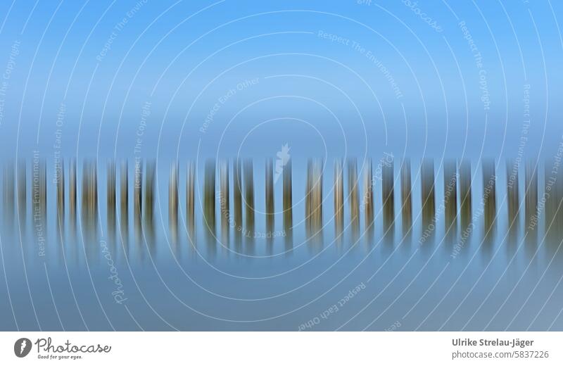North Sea | Wooden piles at high tide with motion blur Landscape seascape Water coastline Picturesque vacation idyllically Calm Harmonious harmony Serene