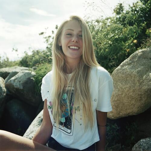 Young, blonde, tall woman on large stones on the beach and smiling - analog backlight shot Woman Girl Large 18 years Long-haired Blonde Summer Smiling Laughter