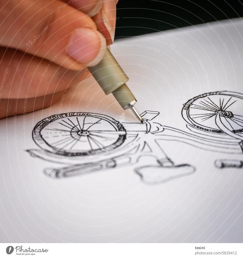 Woman draws a bicycle on paper Art Hand Draw Fingernail Creativity Paper Artist Leisure and hobbies Close-up Painter Colour photo Drawing Work of art Bicycle