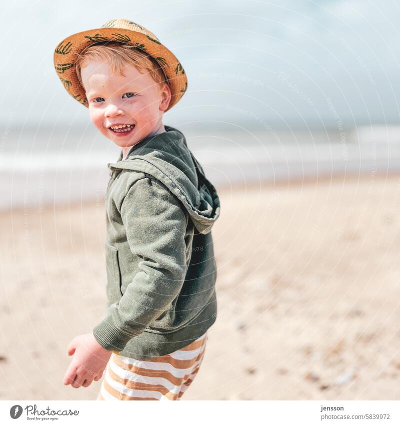 Little boy on the beach laughs into the camera vacation Vacation mood Happiness Vacation & Travel Summer Beach Summer vacation Beach life Child cheerful