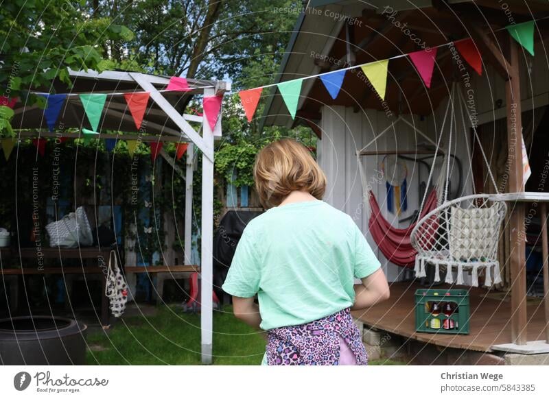 A child can be seen from behind in a decorated garden Girl Feminine Child Colour photo Human being Exterior shot Infancy out Nature Garden tepid Environment